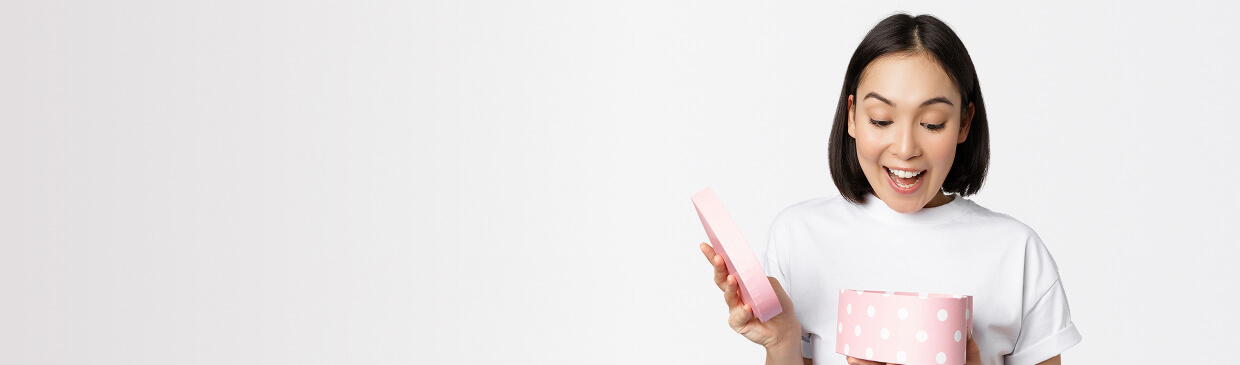 A woman opening a gift